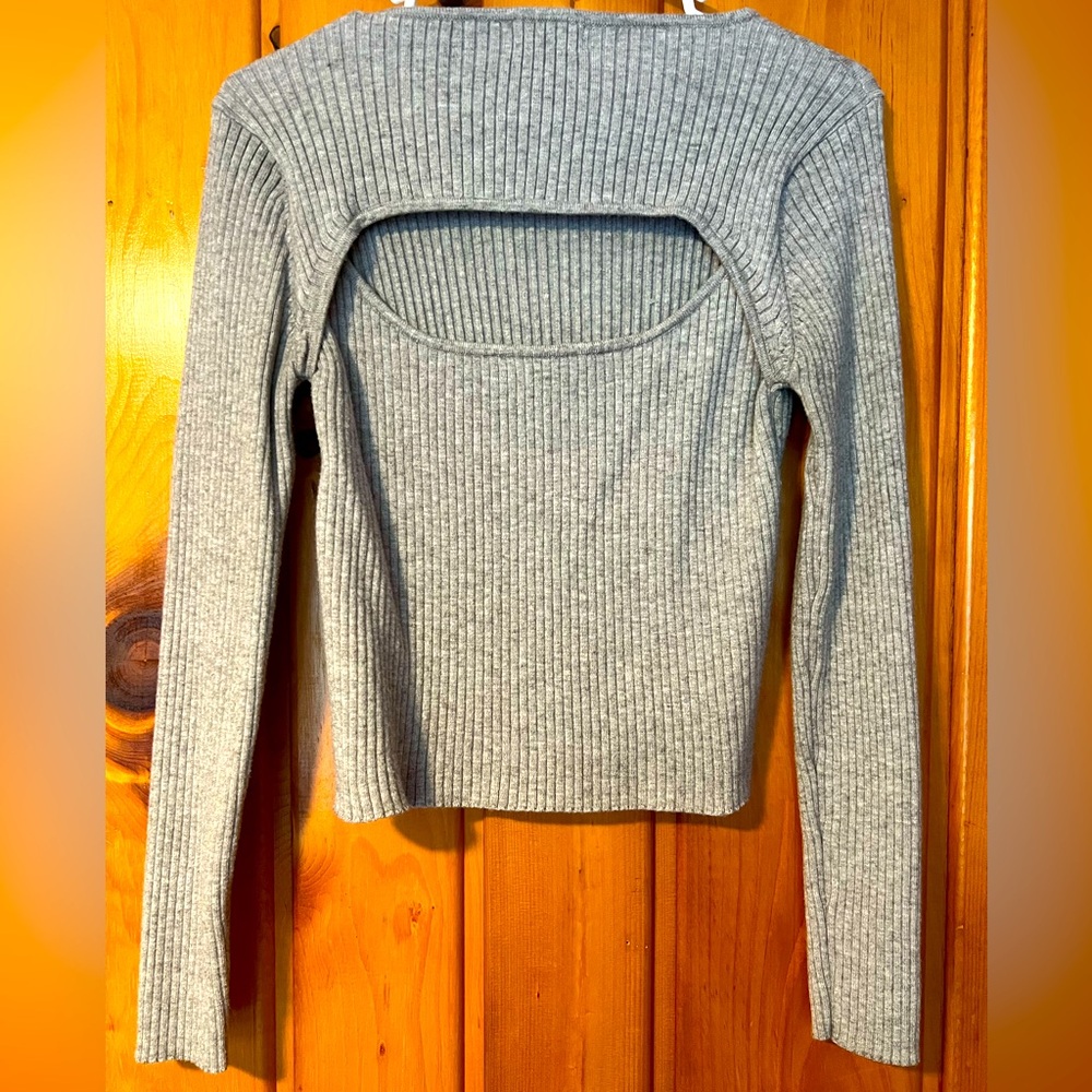 Great shape! Crop style long sleeve with partially open back.